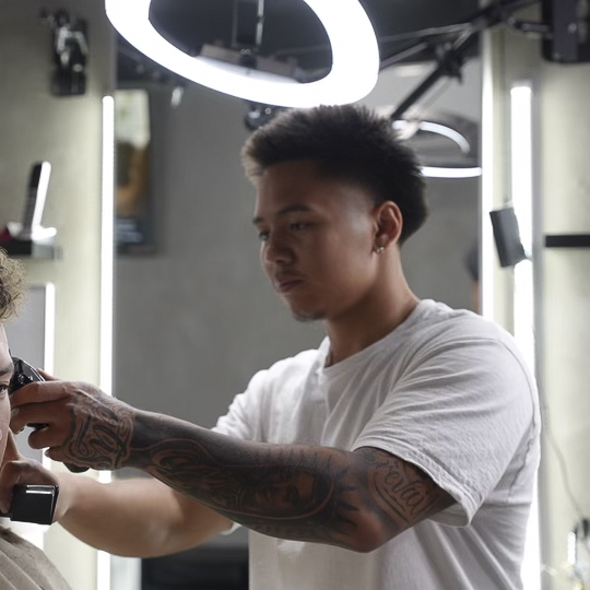 Dame working with a young client