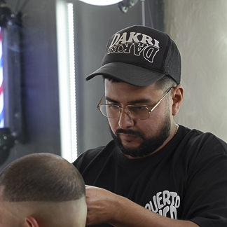 Dan working on a client's haircut