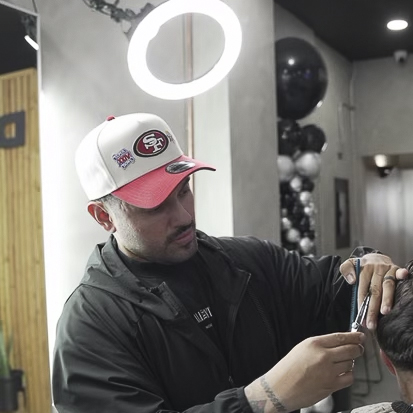 Vega styling a client's hair